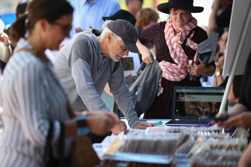 SAN DIEGO CA 4/13/2019: Jim Bliesner of City Heights stopped by the San Diego Professional Editors Network booth during Writers Festival San Diego at the San Diego Central Library. Photo by Howard Lipin/ The San Diego Union-Tribune