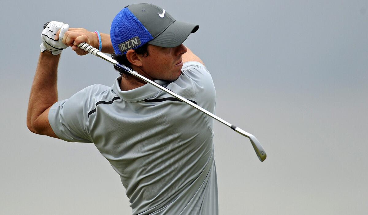 Rory McIlroy follows through on his tee shot at No. 11 during the third round of the British Open on Saturday at Royal Liverpool in Hoylake, England.