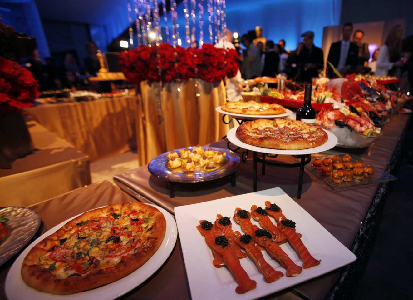 A preview of the spread set for Oscar night included smoked salmon, pizzas and lush florals.