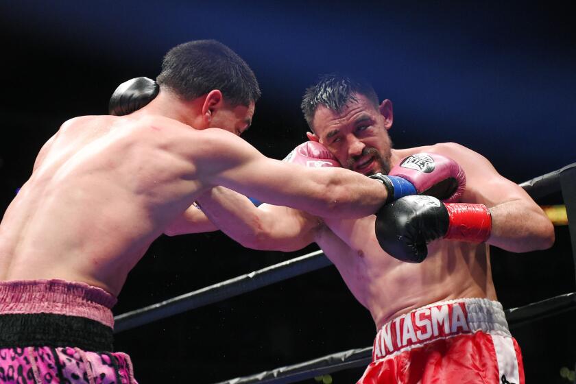 Danny Garcia, left, and Robert Guerrero trade punches along the ropes during their WBC welterweight championship fight on Jan. 23.