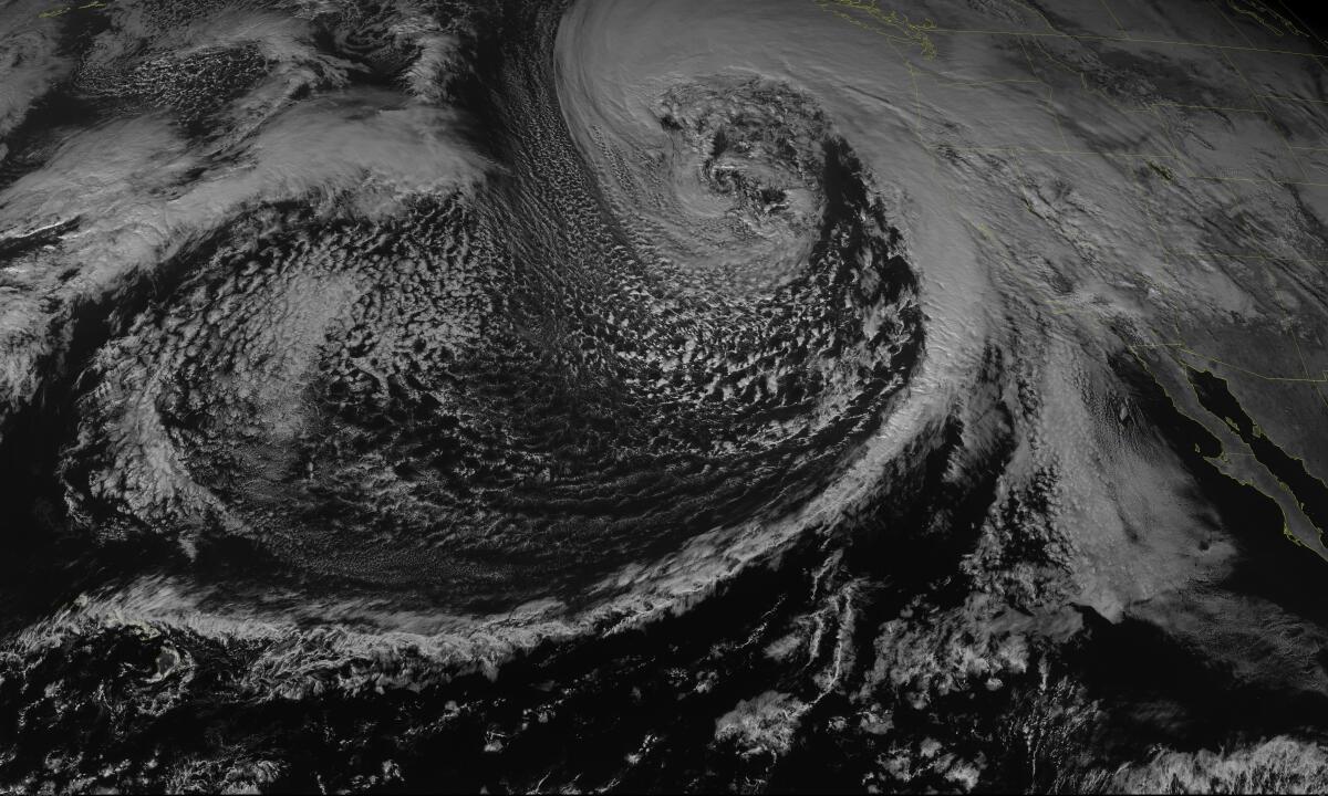 A satellite map of a storm from NOAA shows a mid-latitude cyclone via reflective radiation in the visible spectrum.
