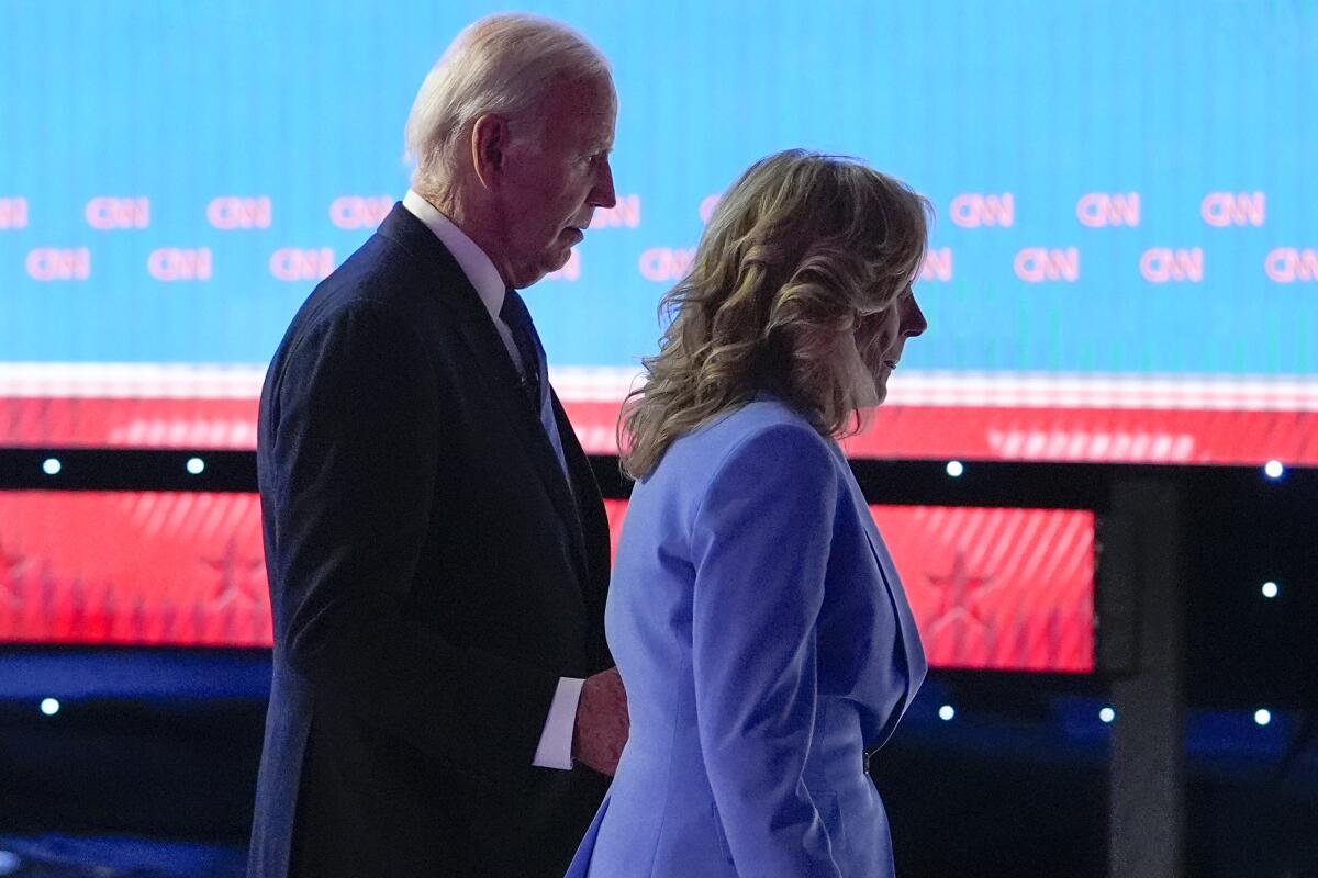 President Biden and First Lady Jill Biden walk off the debate stage.