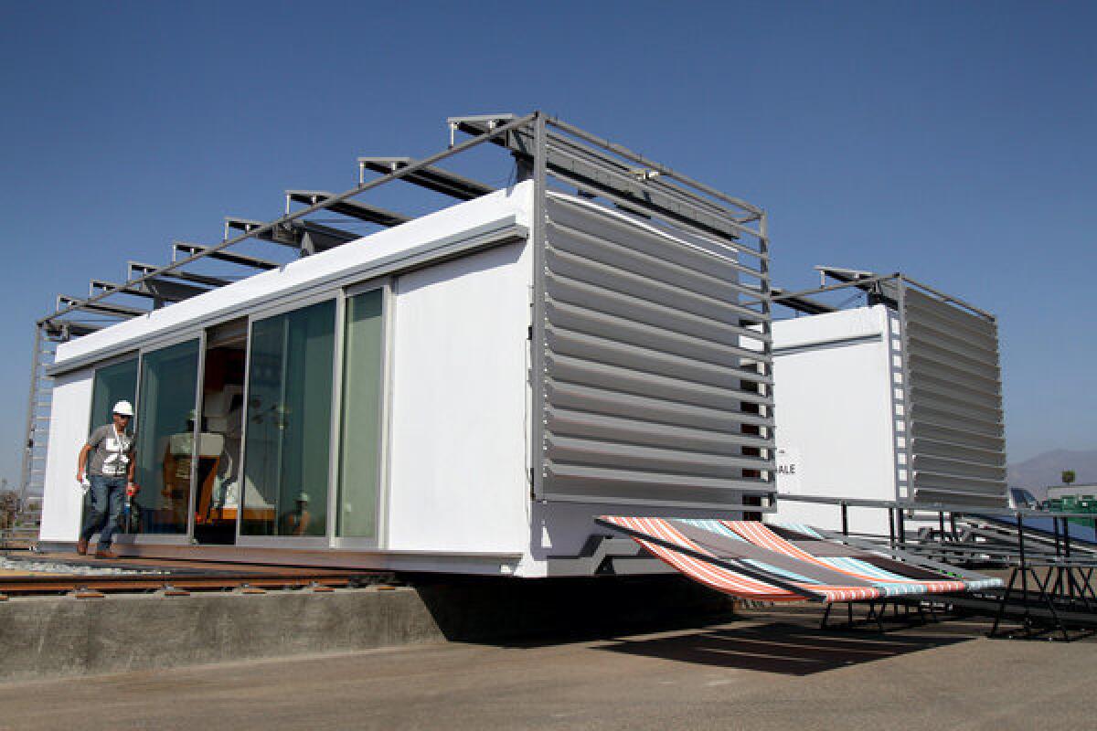 Santa Ana winds force the closing of the Solar Decathlon. Above, a photo of the SCI-Arc and Caltech house from earlier this week.