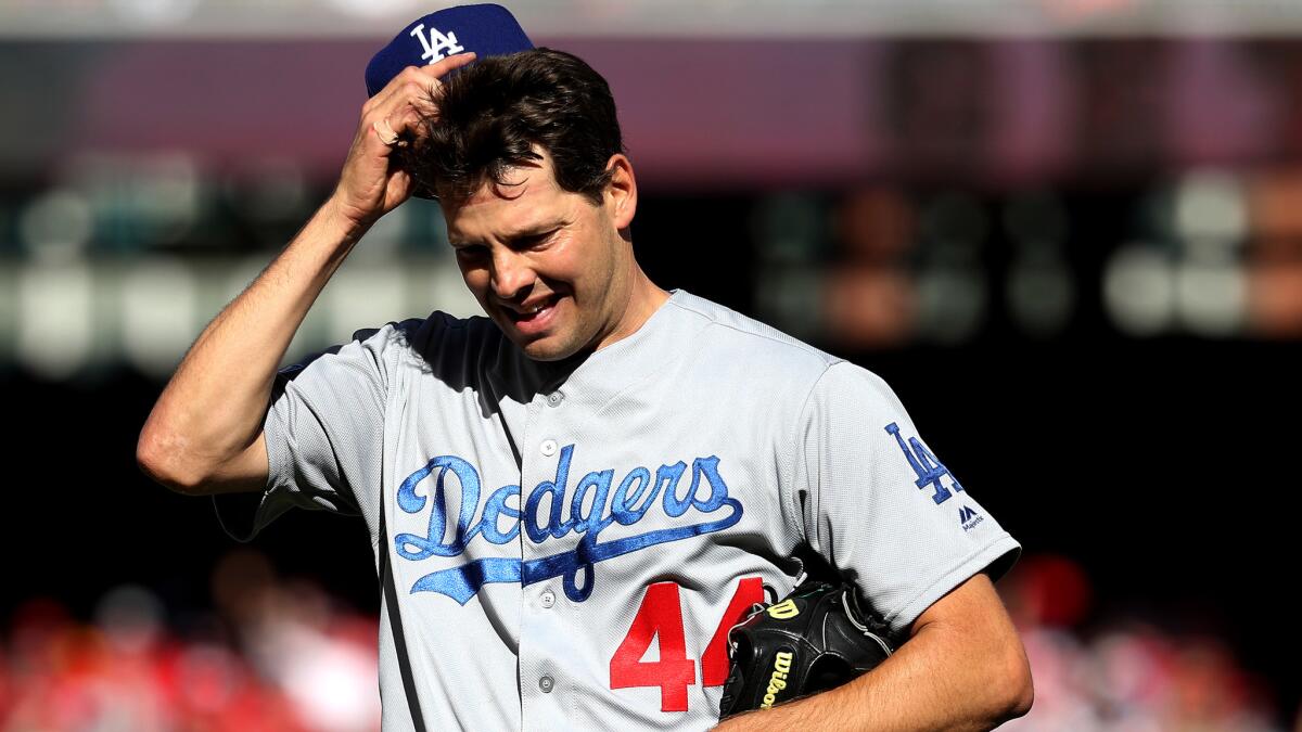 Dodgers starter Rich Hill exits Game 2 against the Nationals after giving up six hits and four runs Sunday. (Rob Carr / Getty Images)