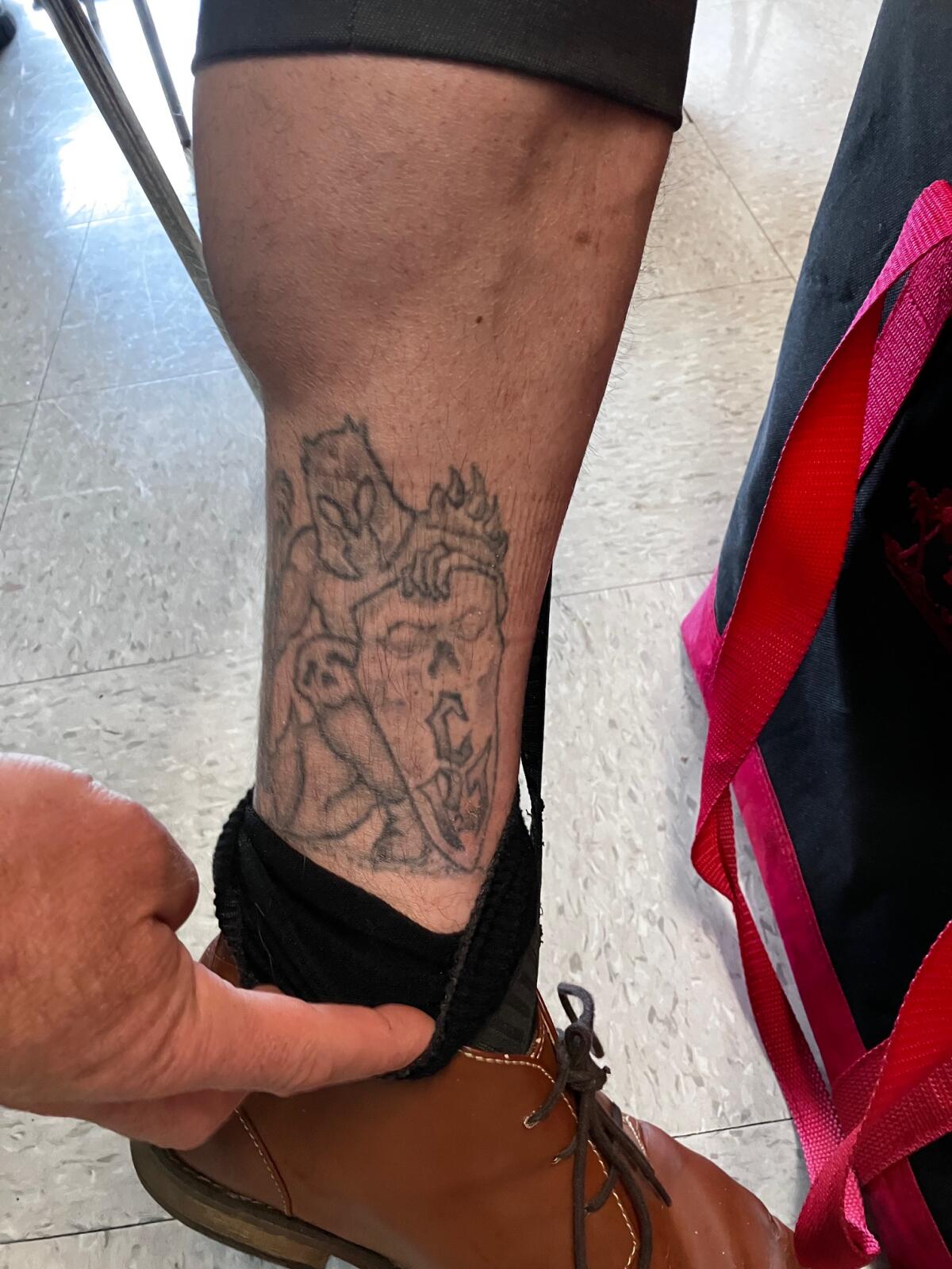 A tattoo on the calf of a Sheriff's Department employee