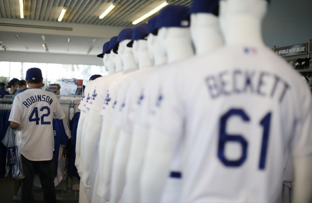 A Dodgers fan shops in a Dodger Stadium team store prior to the start of Game 4 of the National League Championship Series in October.