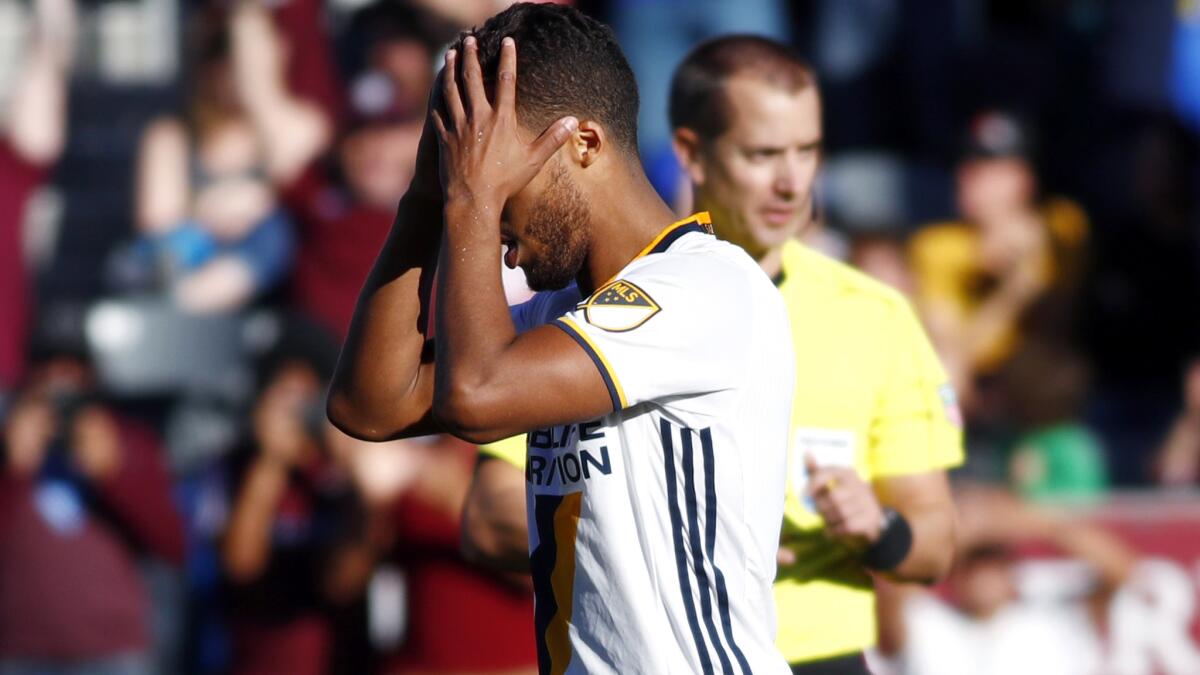 Galaxy forward Giovani dos Santos reacts after his kick went over the goal in the shootout against the Colorado Rapids.