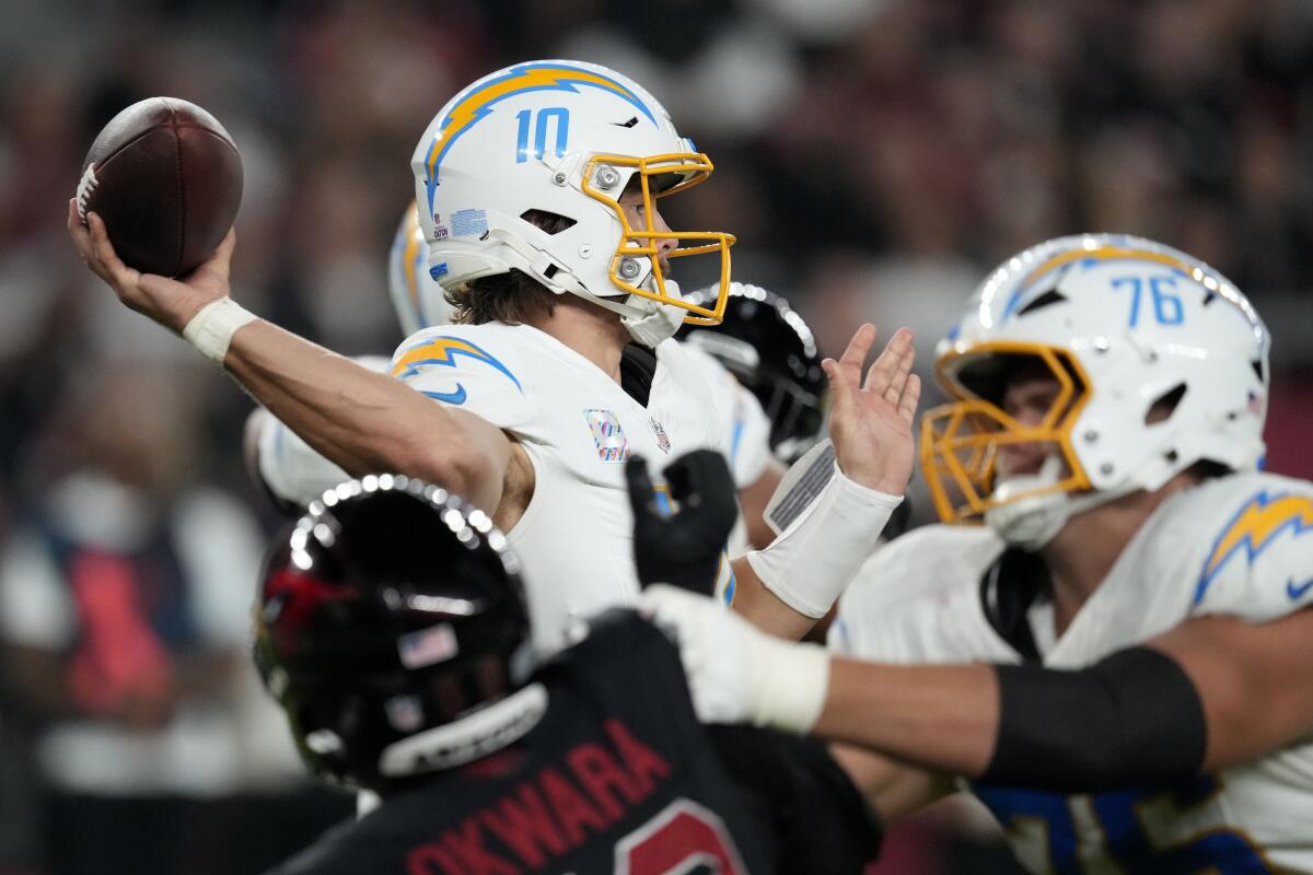 Chargers quarterback Justin Herbert passes during the first half against the Cardinals on Monday.