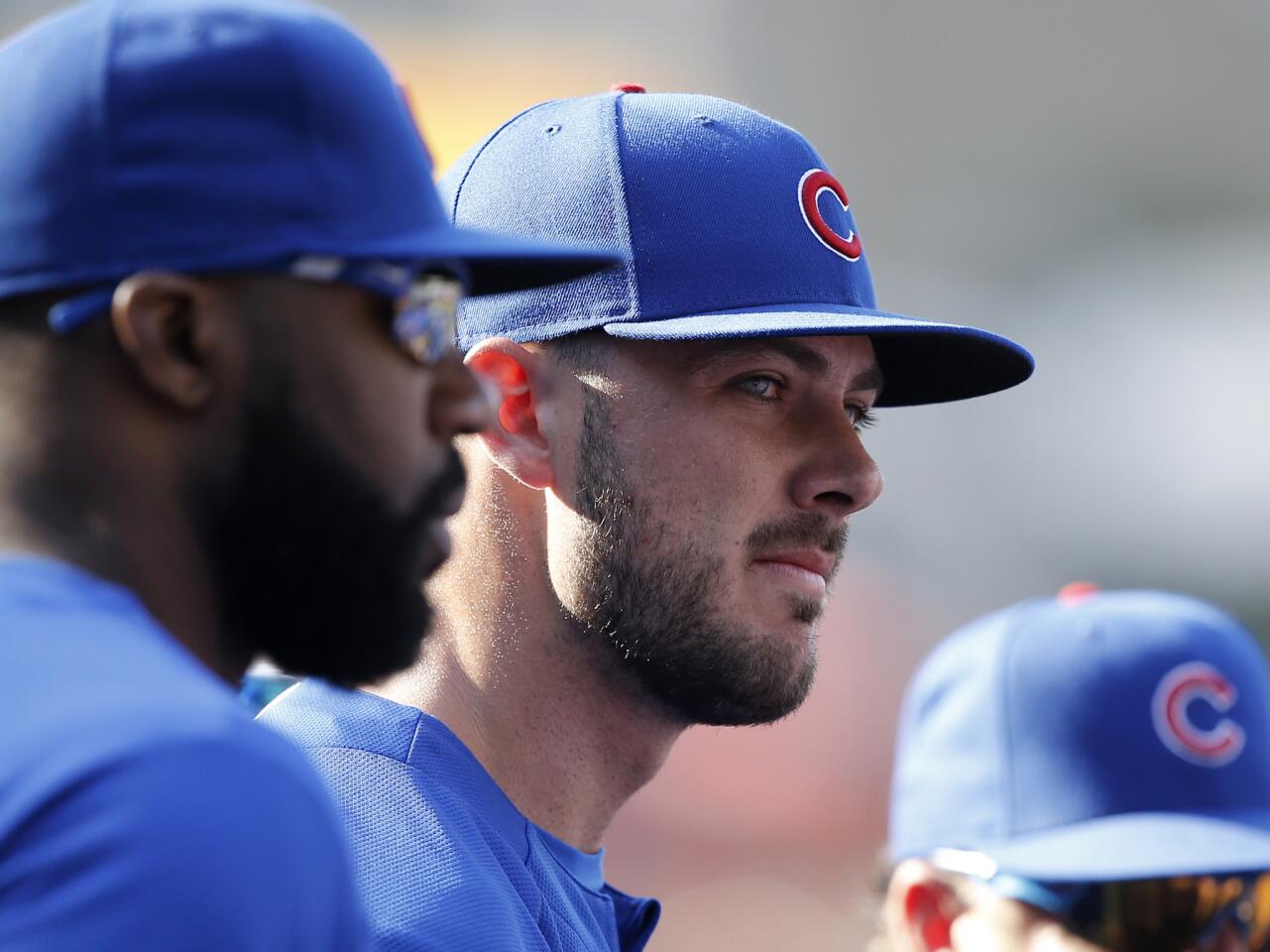 The Cubs' Kris Bryant, center, listens to the team group discussion before a game against the Padres in San Diego, Friday, July 13, 2018.