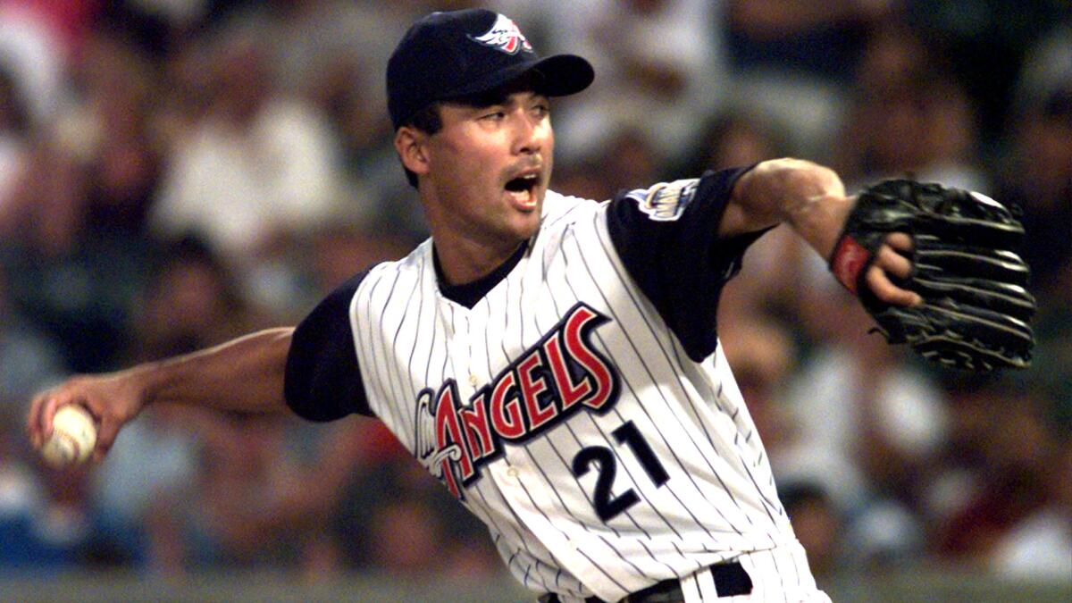 Shigetoshi Hasegawa works in relief for the Angels during a game against the Red Sox in 1998.