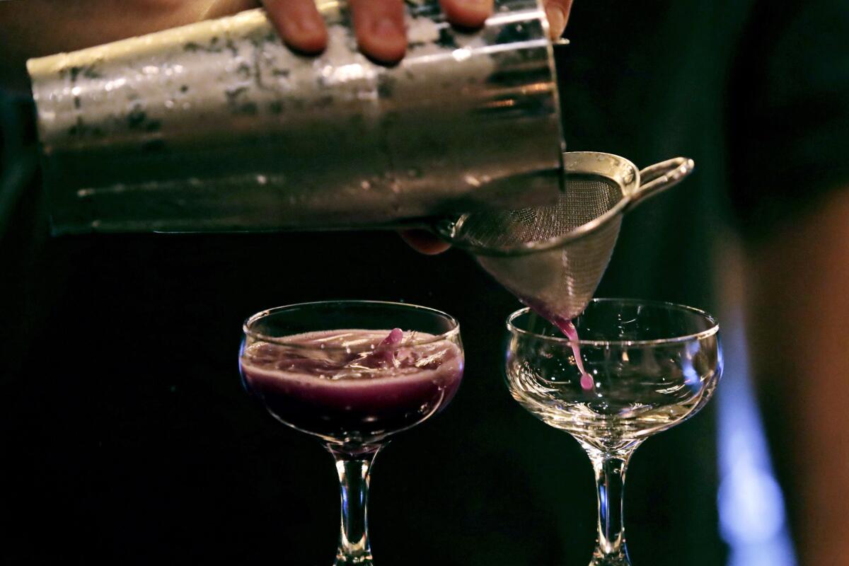 Cocktails are poured at Wink & Nod, a speakeasy-inspired basement bar in Boston.
