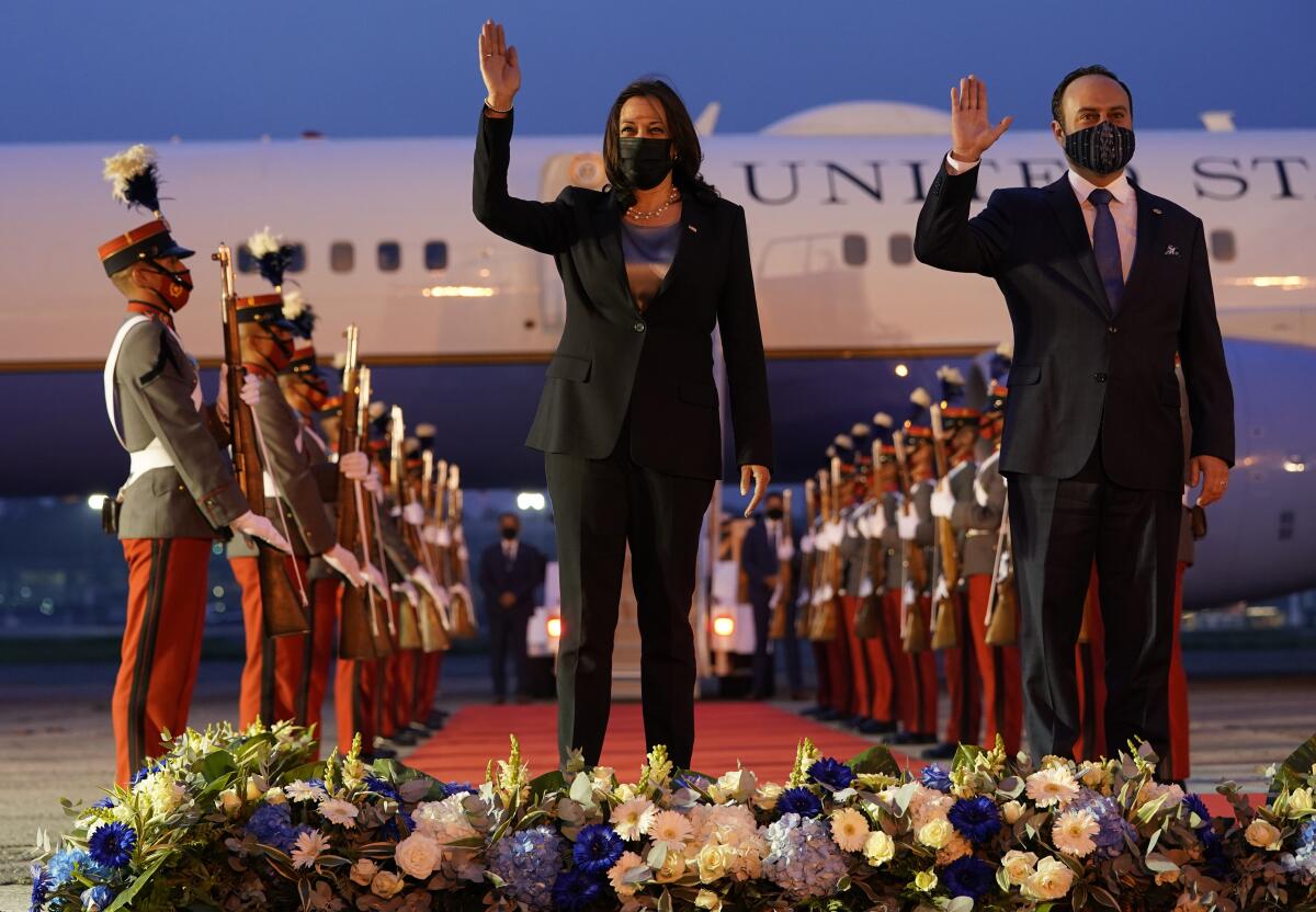 Vice President Kamala Harris and Guatemala's Minister of Foreign Affairs Pedro Brolo wave at her arrival ceremony in Guatemala City, Sunday, June 6, 2021, at Guatemalan Air Force Central Command. (AP Photo/Jacquelyn Martin)
