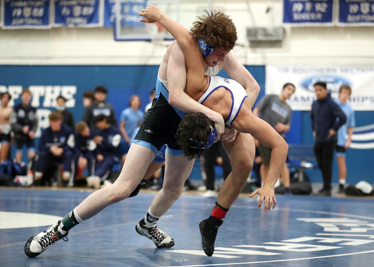 Corona del Mar's Zion Hernandez drives Western's Christopher Mercado into position for a pin during the 152-pound match.