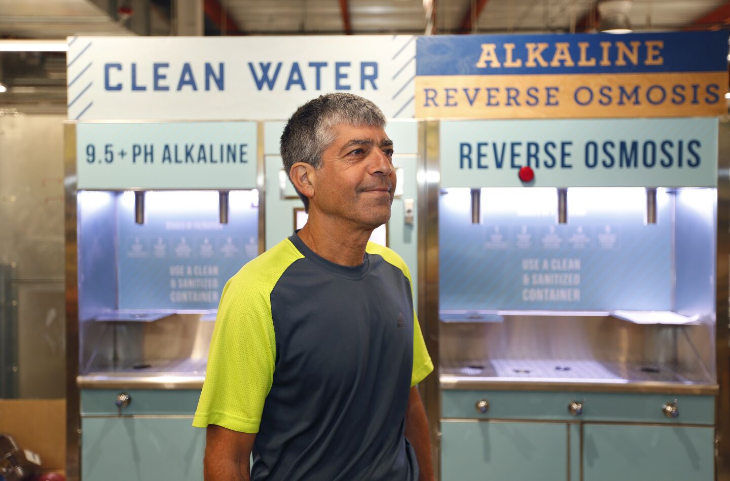 Jimbo Someck, founder and president, Jimbo’s Naturally stands near a water machine at a new Del Mar location on Sept. 17, 2019. The store doesn't sell any water in plastic bottles.