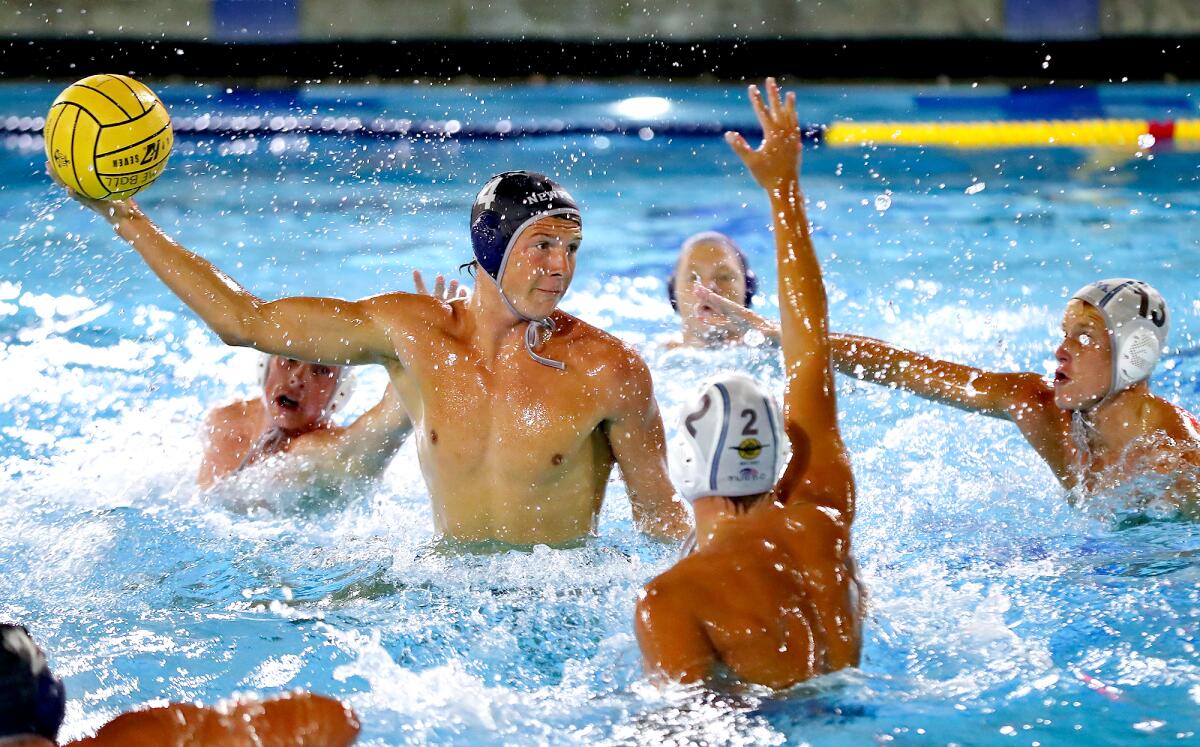 Peter Castillo (4) of Newport Harbor rises up for a shot and score during the Battle of the Bay match against rival CdM.