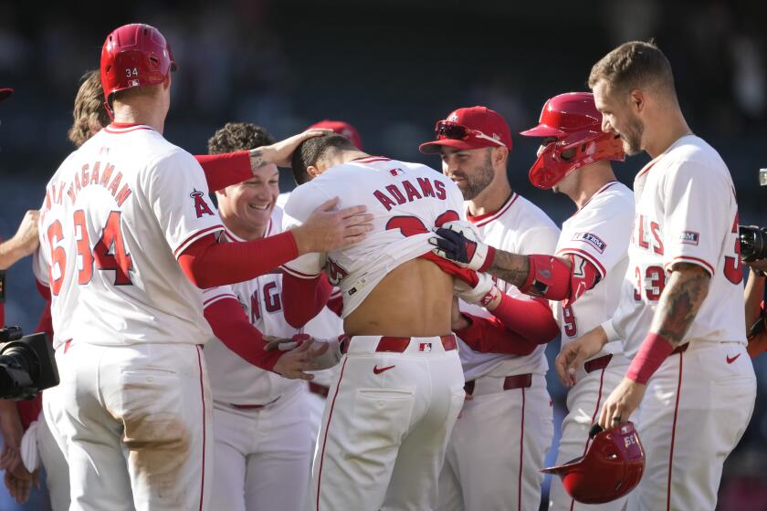 Los Angeles Angels' Jordyn Adams (39) celebrates after a walk-off single during the thirteenth inning to win 4-3 over the Chicago White Sox in a baseball game in Anaheim, Calif., Wednesday, Sept. 18, 2024. (AP Photo/Ashley Landis)