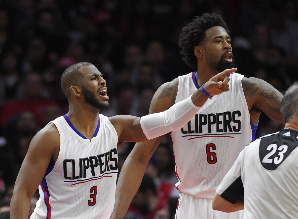 The Clippers' Chris Paul, left, and DeAndre Jordan gesture to teammates during a game against Chicago on Jan. 31.