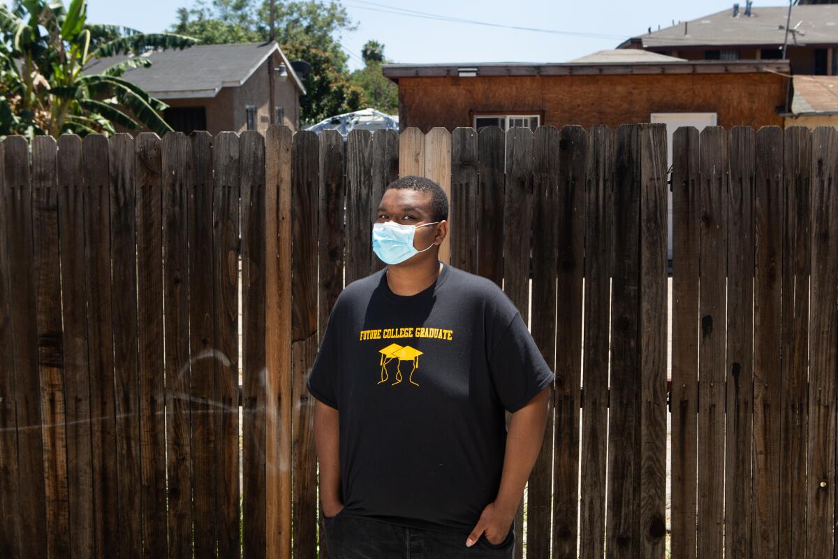 Keith Wallick, 17, poses for a portrait in his South L.A. neighborhood. 