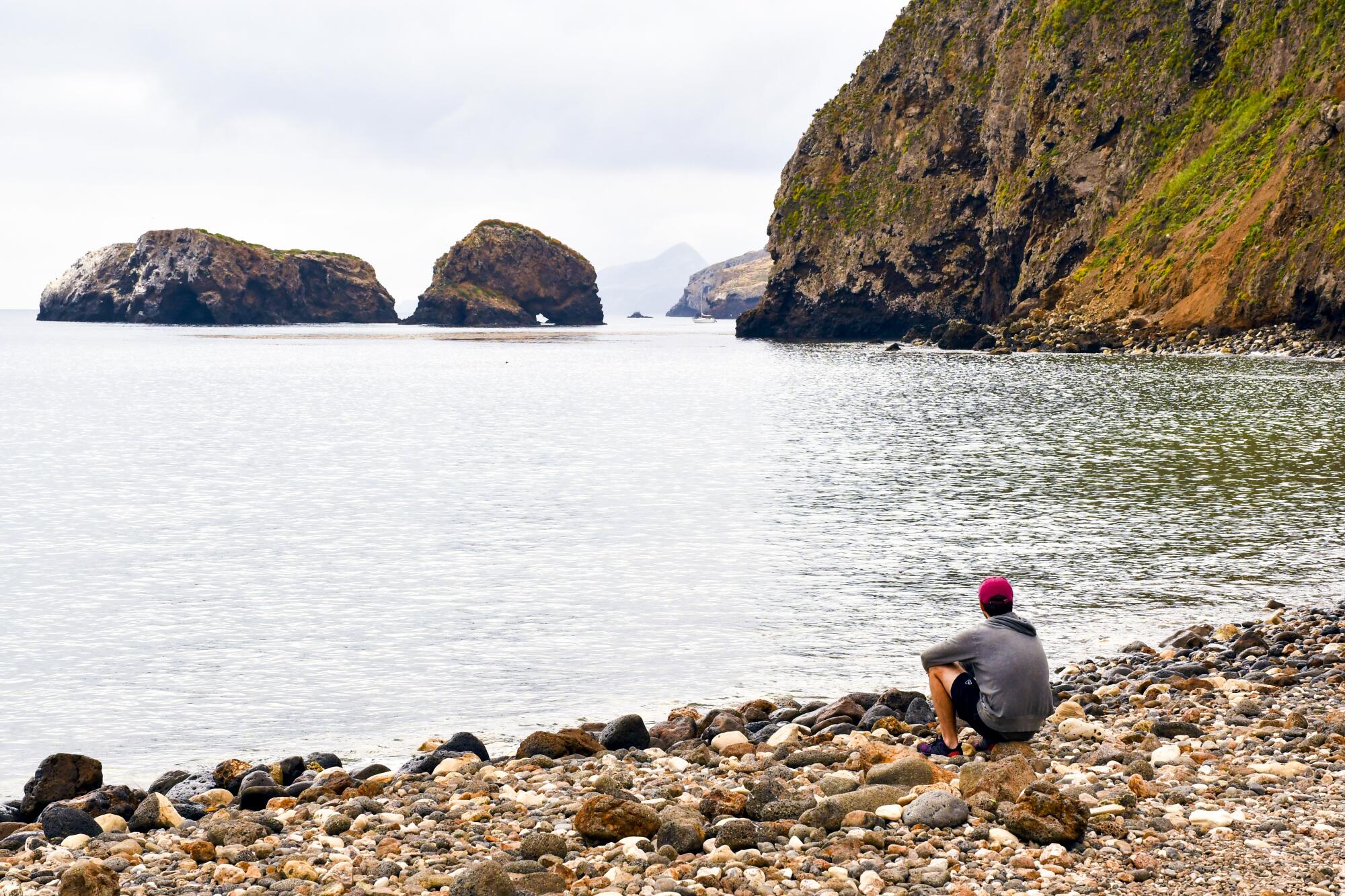 A visitor takes in Scorpion Anchorage on Santa Cruz Island in Channel Islands National Park.
