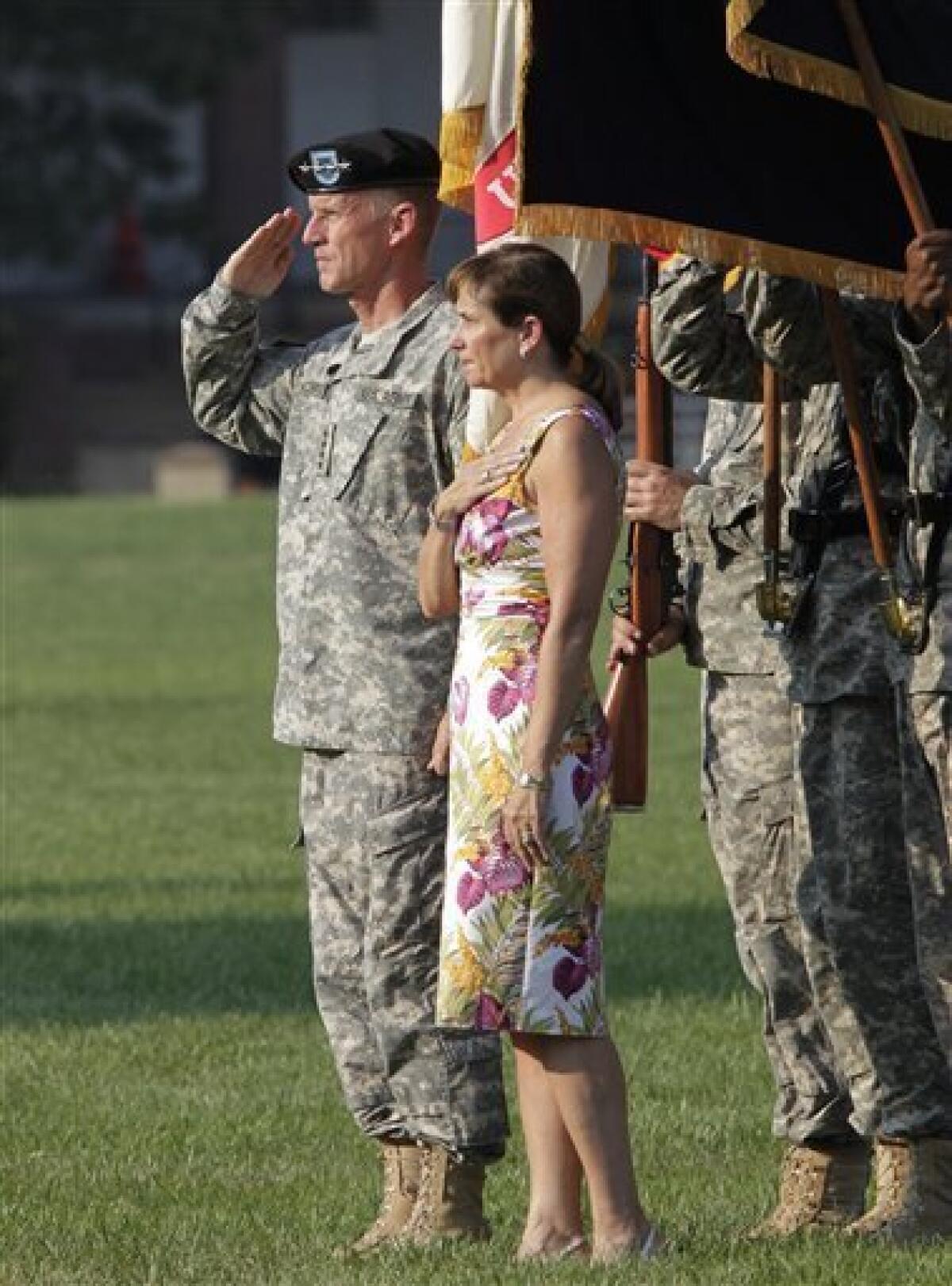 Gen. Stanley McChrystal and his wife Annie stand for the national anthem as he is honored at a retirement ceremony at Fort McNair in Washington, Friday, July 23, 2010. McChrystal's illustrious career came to an abrupt end when he resigned as the top U.S. commander in Afghanistan after he and his staff were quoted in a Rolling Stone magazine article criticizing and mocking key Obama Administration officials. (AP Photo/J. Scott Applewhite)