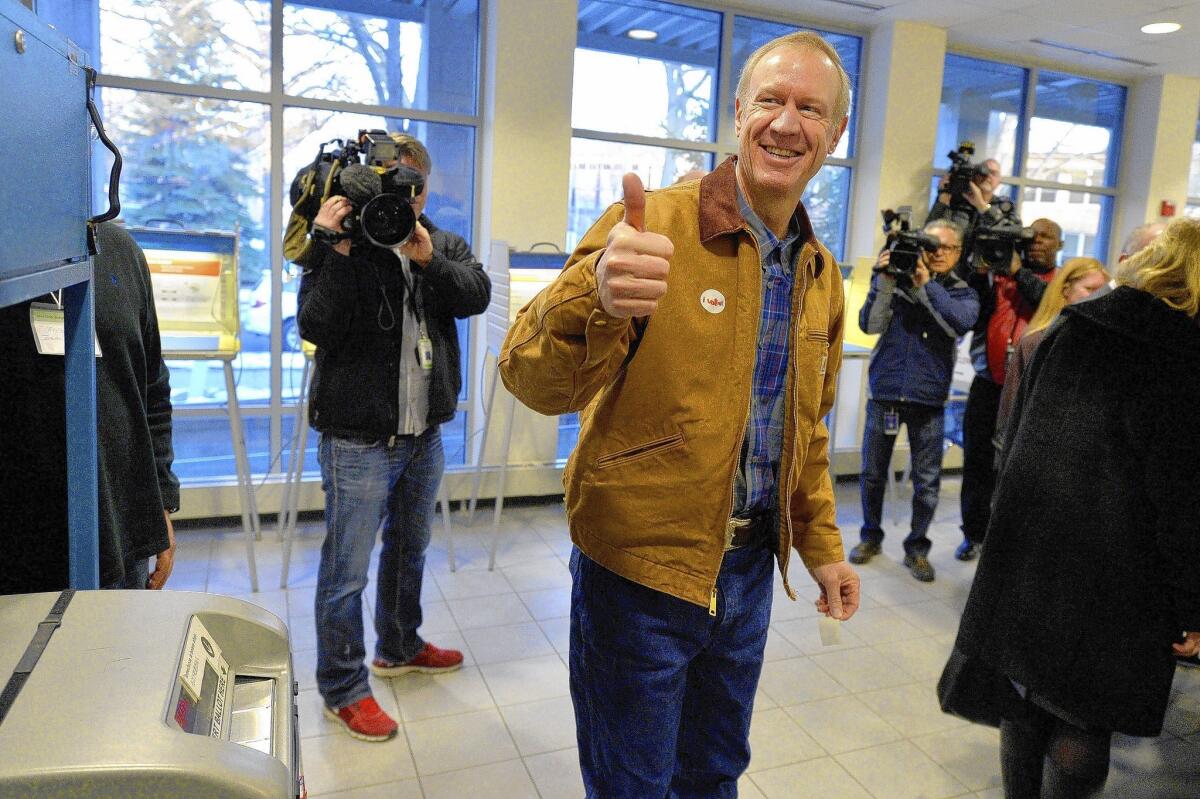 Gubernatorial candidate Bruce Rauner casts his ballot in the GOP primary in Winnetka, Ill. The venture capital tycoon has shown disdain for public employee unions, but it’s unclear whether they will back Gov. Pat Quinn.