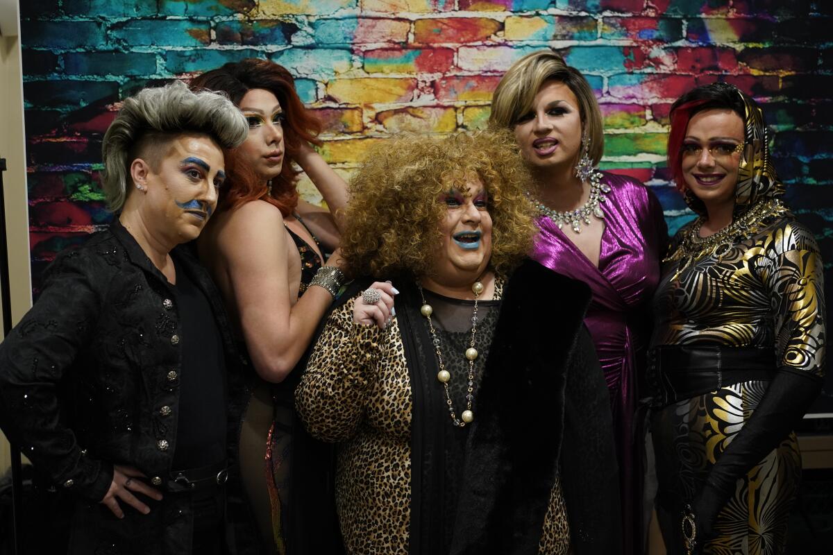 Members of the Daniels drag family pose for a photograph.