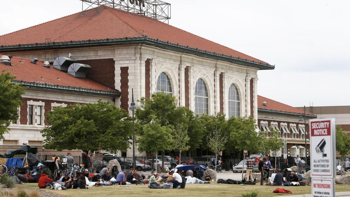 People camp in front of the historic Rio Grande train station just south of the Road Home shelter in Salt Lake City.