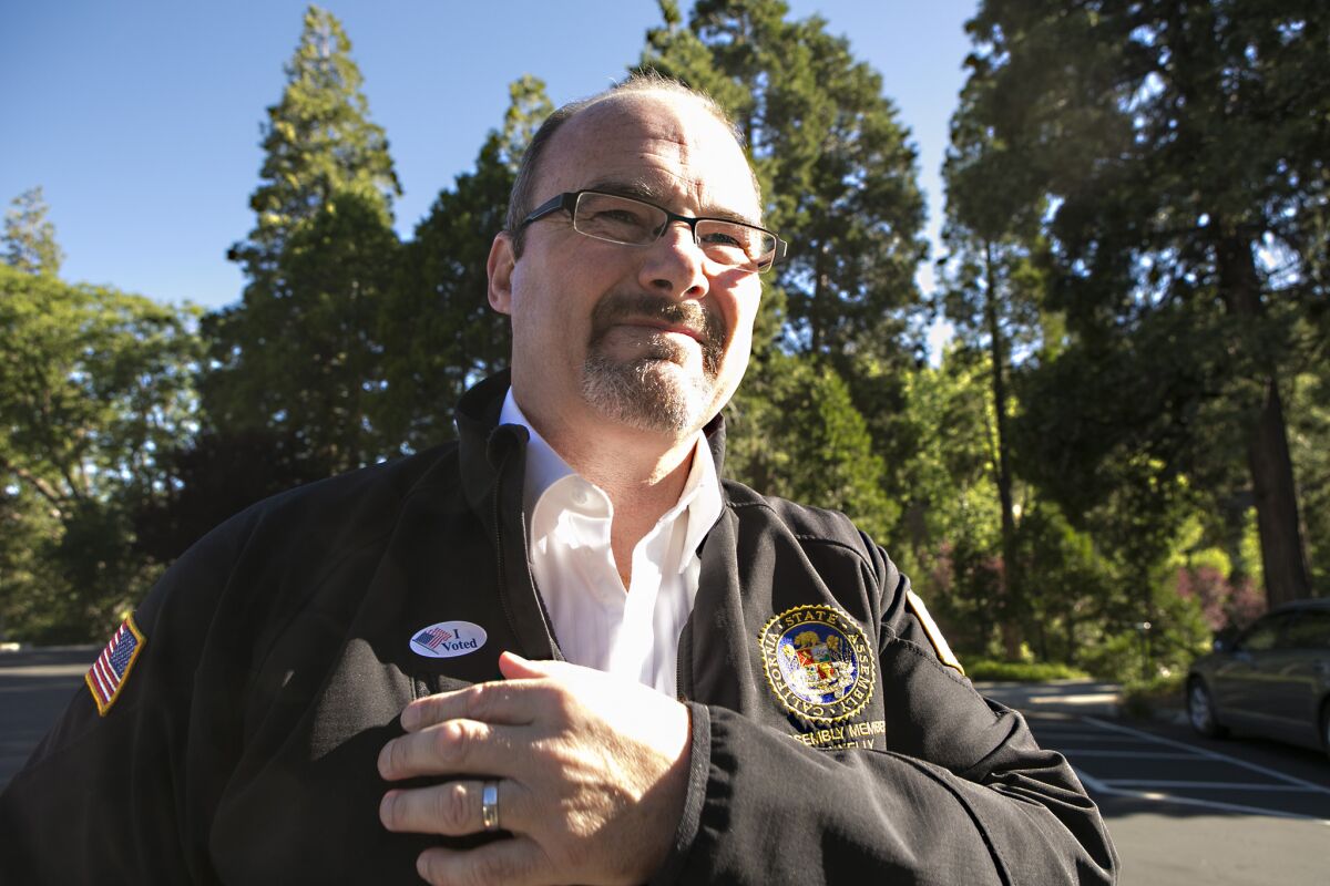 Tim Donnelly leaves the polling place at Lake Arrowhead Country Club after casting his vote in June 2014 during his unsuccessful bid for governor. On Wednesday, Donnelly filed a proposed referendum to place California's new vaccination law before voters.
