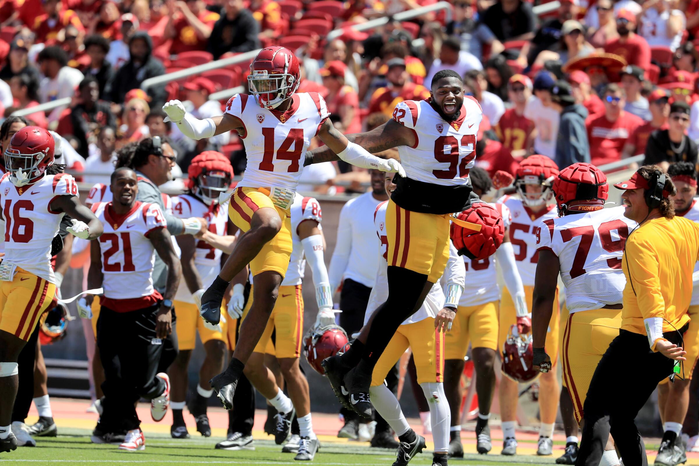USC defensive back Jacobe Covington, left, celebrates with teammate Lyon Barrs after picking off a pass.