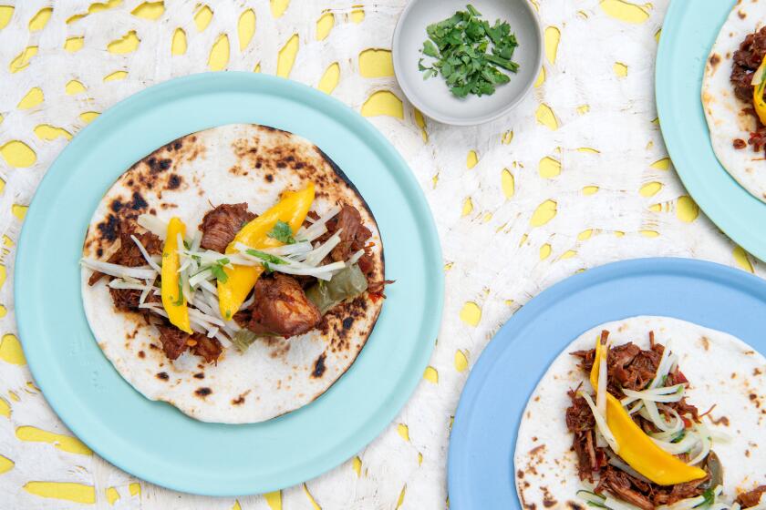 LOS ANGELES, CA-June 28, 2019: Instant Pot Hatch Chile Pork Tacos with Kohlrabi Mango Slaw on Friday, June 28, 2019. Food styling by Genevieve Ko. (Mariah Tauger / Los Angeles Times)