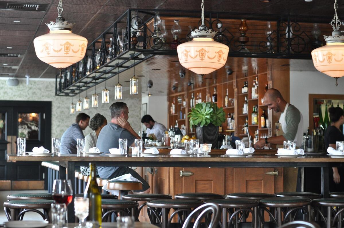 The interior of Hatchet Hall, the newish restaurant from chef Brian Dunsmoor in Culver City, is filled with mirrors and silver and taxidermy.