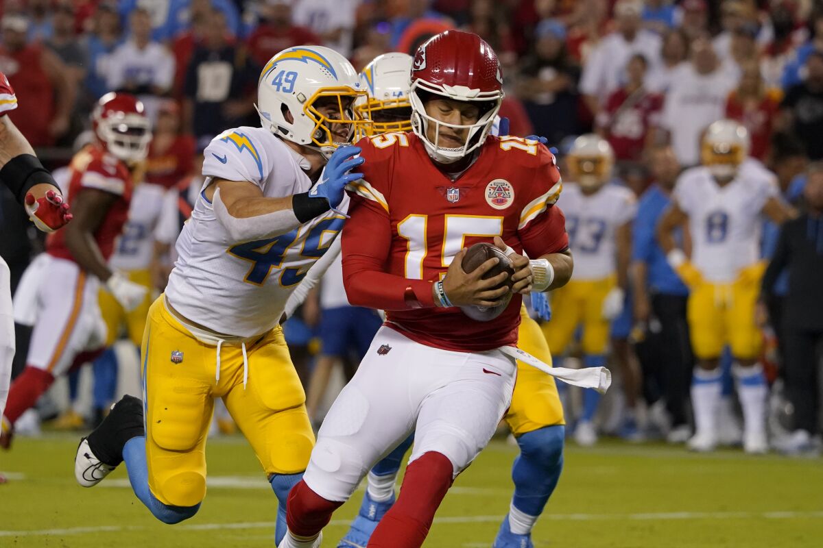 Kansas City Chiefs quarterback Patrick Mahomes is sacked by Chargers linebacker Drue Tranquill during the first.