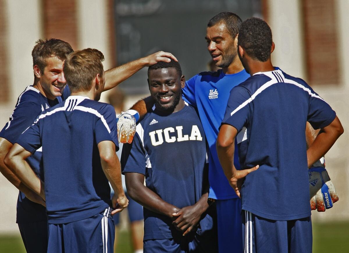 UCLA men's soccer players -- from left, Leo Stolz, Felix Vobejda, Andrew Tusaazemajja, Earl Edwards Jr. and Aaron Simmons -- share a lighter moment at practice.