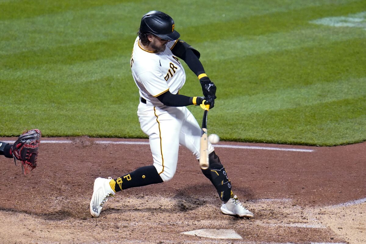 Pittsburgh Pirates' Michael Chavis hits an RBI single off Washington Nationals relief pitcher Steve Cishek during the fifth inning of a baseball game in Pittsburgh, Saturday, April 16, 2022. (AP Photo/Gene J. Puskar)