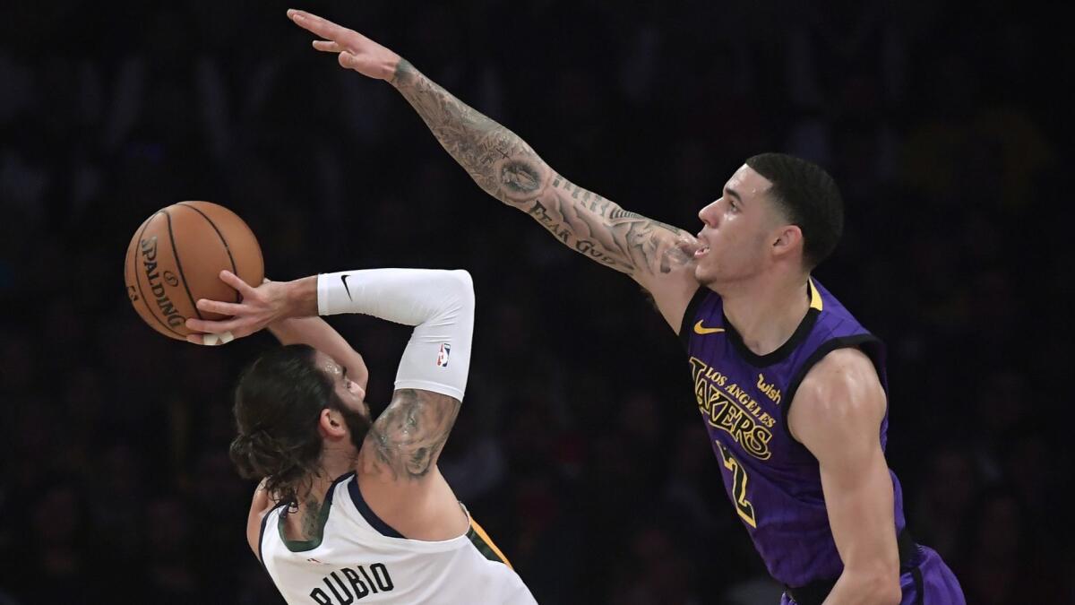 Lakers guard Lonzo Ball forces Jazz guard Ricky Rubio into an awkward shot during their game Friday.