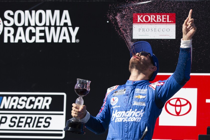 Kyle Larson celebrates his victory in a NASCAR Cup Series auto race, Sunday, June 6, 2021, at Sonoma Raceway in Sonoma, Calif. (AP Photo/D. Ross Cameron)