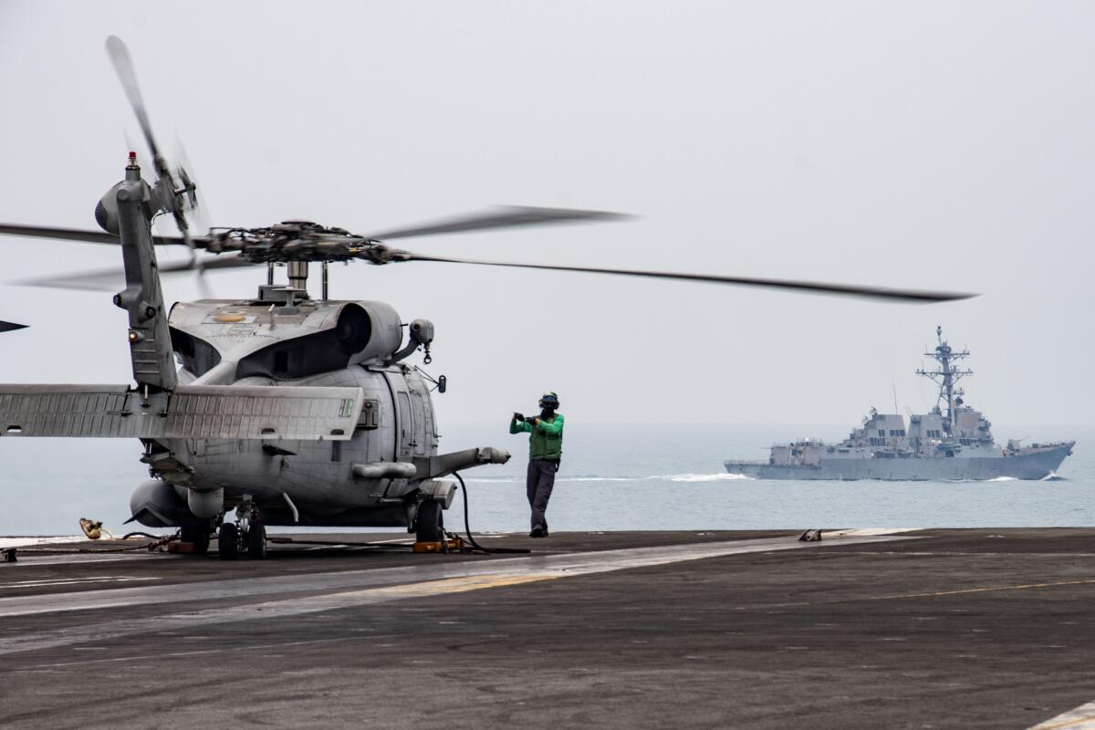 July 2020 photo of an MH-60R Sea Hawk on the flight deck of the USS Ronald Reagan in South China Sea.