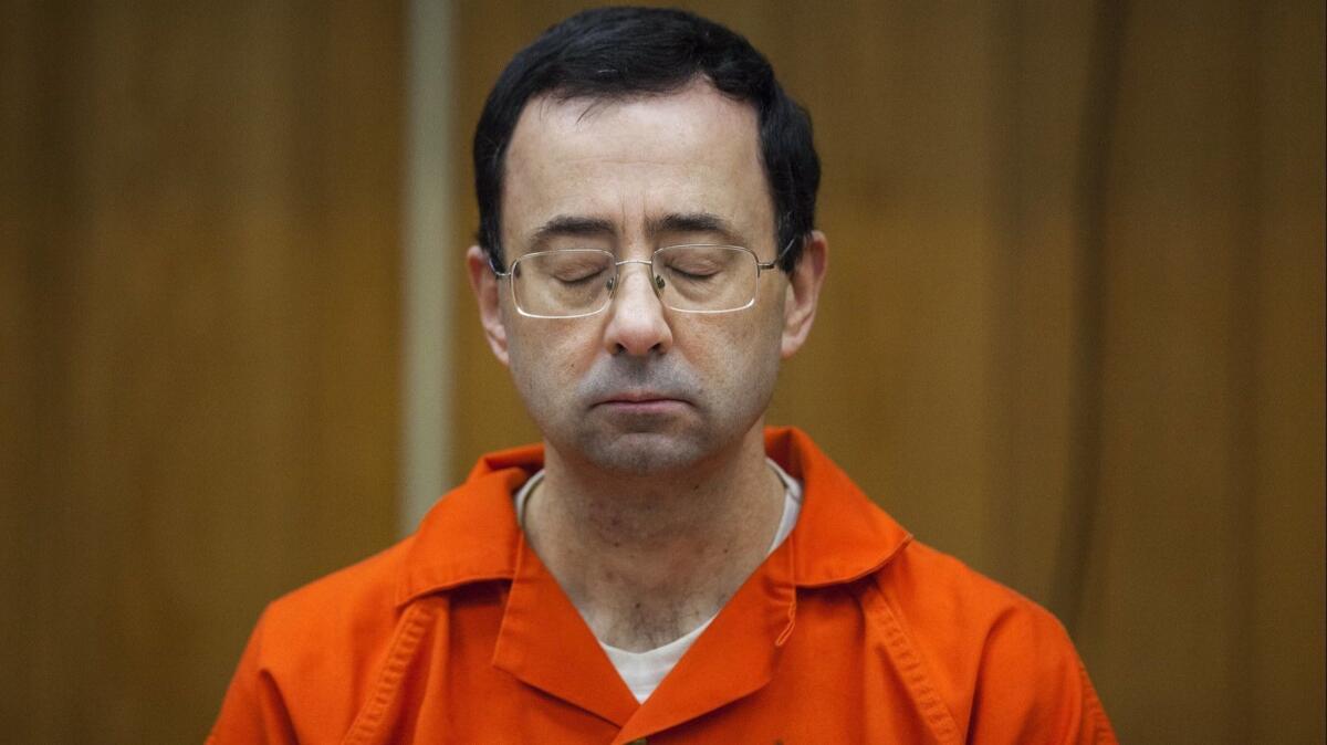 Disgraced sports doctor Larry Nassar listens during his sentencing at Eaton County Circuit Court in Charlotte, Mich., on Feb. 5.