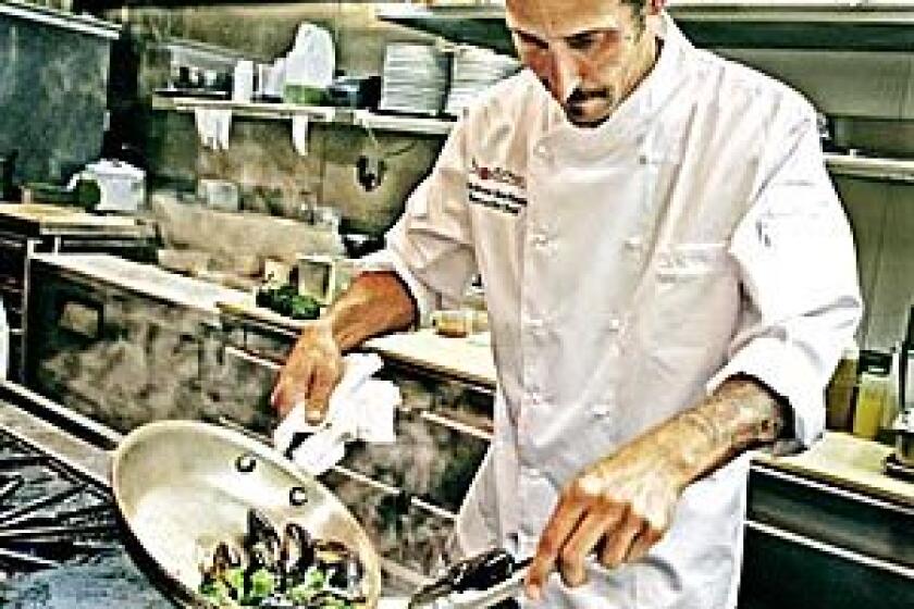 Chef de cuisine Andrew Kirshner, here in the kitchen at Wilshire, was promoted to executive chef in February. Kirshner has pulled back the menu, stripping away anything fussy and going for straightforward California cuisine with a broader appeal.