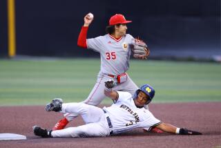 Wyatt Hanoian of Orange Lutheran prepares to make throw as Ryan Limerock of Sherman Oaks.