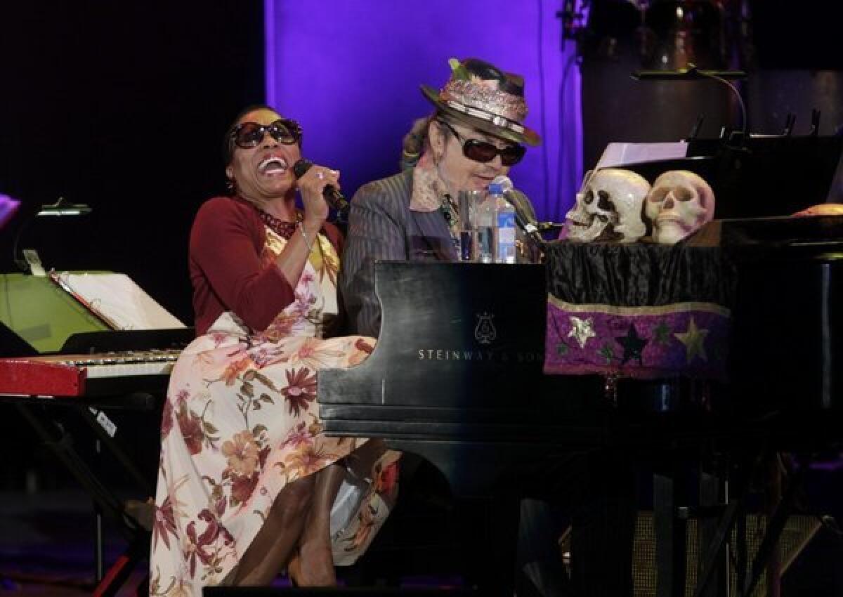 Dr. John performs with Dee Dee Bridgewater on a playful "Sweet Hunk of Trash" during a concert honoring Louis Armstrong.