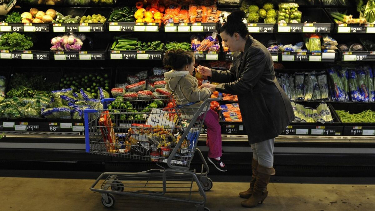 A Rhode Island woman uses food stamps to stock up for her family.