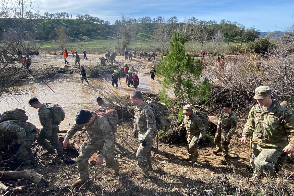 National Guard troops, sheriff's office personnel and firefighters search for missing 5-year-old Kyle Doan near San Miguel. 