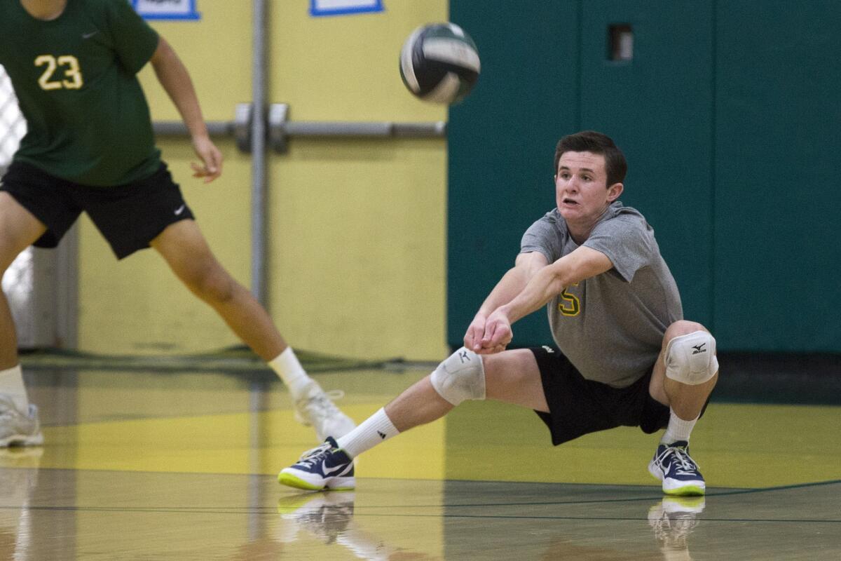 Edison's Cole Power comes up with a dig against Newport Harbor during a volleyball tournament at Edison High on Saturday, March 17, 2018.