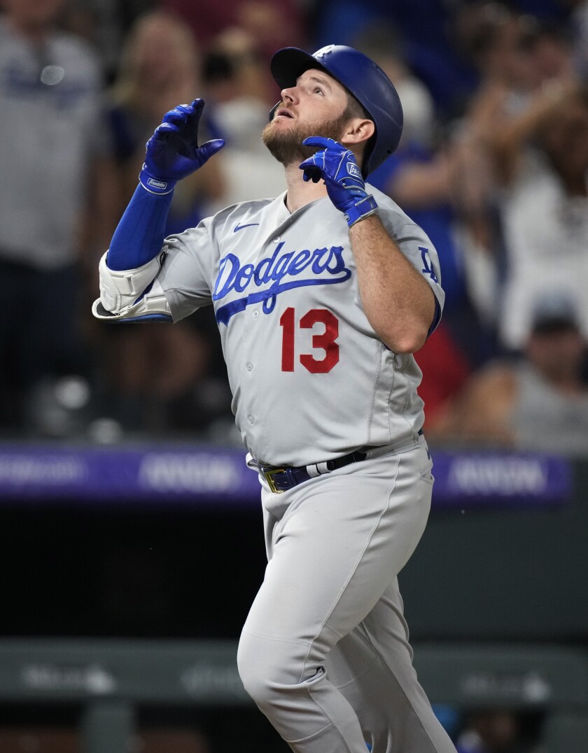 The Dodgers' Max Muncy looks skyward after hitting a two-run homer in the ninth inning.