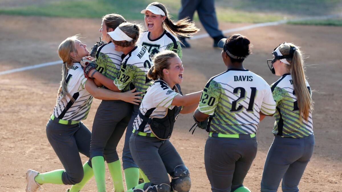 Texas Dirt Divas celebrate after their victory over the OC Batbusters Campbell in the championship game of the PGF Nationals 14U Premier division at Bill Barber Park in Irvine. PHOTO BY CHRISTINE COTTER/CONTRIBUTING PHOTOGRAPHER