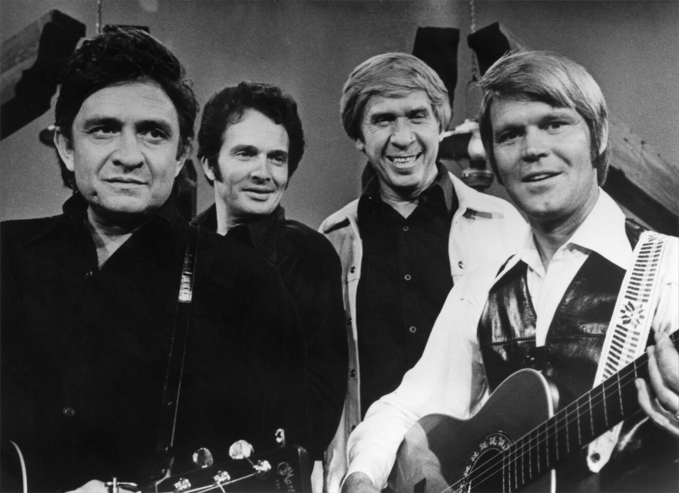 Johnny Cash, Merle Haggard, Buck Owens and Glen Campbell perform on a TV show in the mid-1970s.