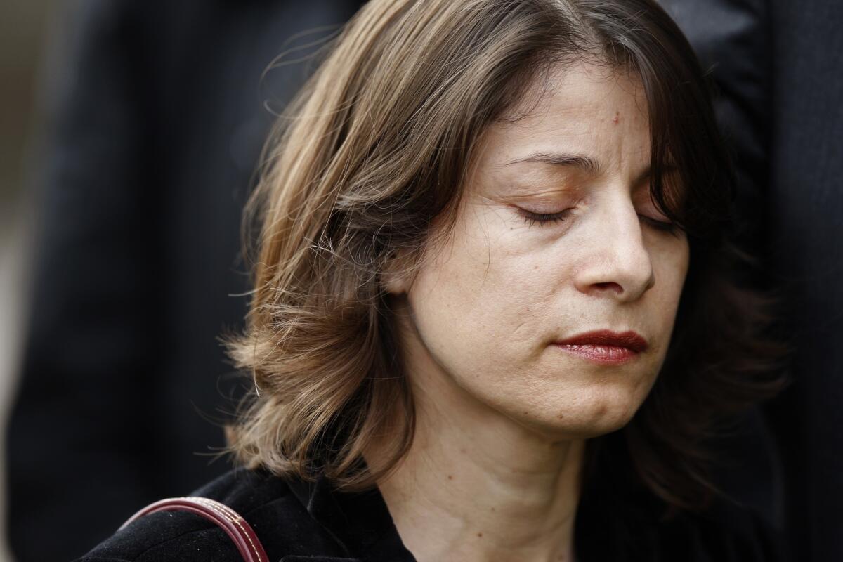 Norma Esparza closes her eyes during a press conference in 2013.