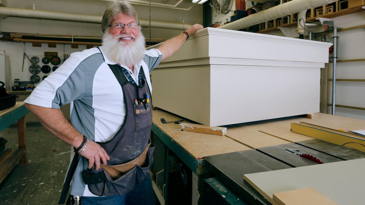 Bowers Museum shop carpenter Jeff Cassidy also works as a Santa Claus around the holidays.