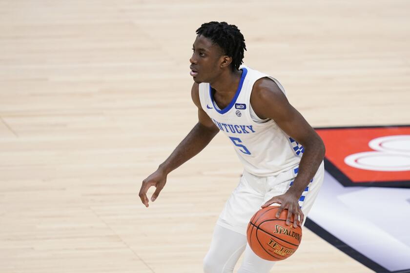 Terrence Clarke handles the ball for Kentucky against Kansas on Dec. 1, 2020, in Indianapolis.